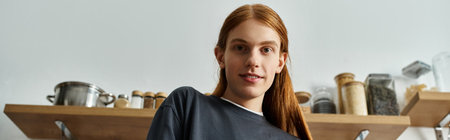 Relaxing in his stylish apartment, a handsome redhead embraces a cozy lifestyle moment, bannerの写真素材