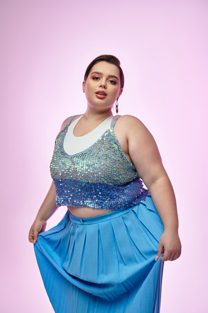Young and beautiful plus size woman showcases style and poise in a colorful ensembleのeditorial素材