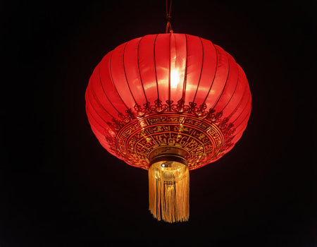 Red lantern glows warmly, enhancing Lunar New Year festivities and celebrating traditions.の素材