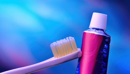 Vibrant colors showcase a toothbrush and toothpaste, stressing daily dental hygiene.の素材