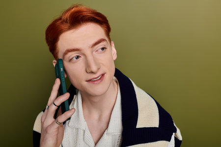 A young man shows his emotional side during an expressive phone conversation.