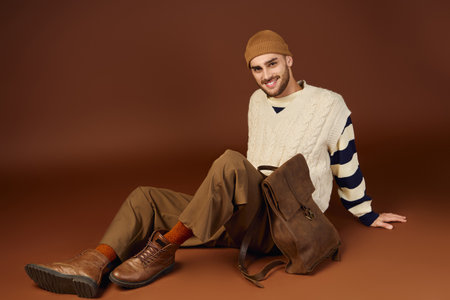 A handsome young man models a fashionable winter outfit, highlighting his unique sense of style.の写真素材
