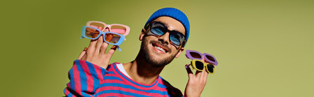 A stylish young man confidently displays his fashion sense while wearing vibrant sunglasses, banner