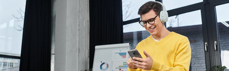 New employee embraces technology, smiling and engaged while onboarding in a modern workspace.