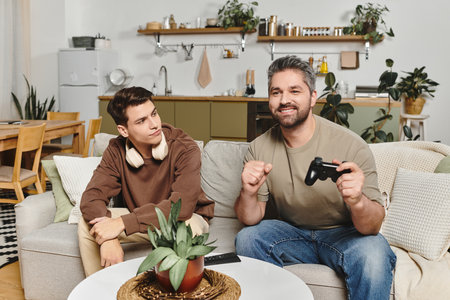 Two brothers share a cozy moment at home while enjoying a game and each others company.