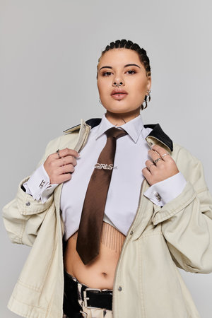 A young woman showcases her fashion sense with braids and a stylish outfit that captures attention.のeditorial素材