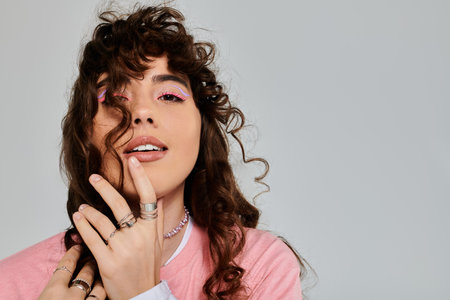 Young woman with curly hair showcases her fashion sense and vibrant personality in a joyful moment.