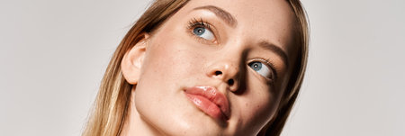 A beautiful young woman exudes confidence while highlighting trendy spring attire with elegance.の写真素材