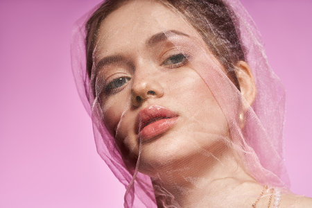 A woman exudes youthful beauty and style, captivating everyone around her.の写真素材