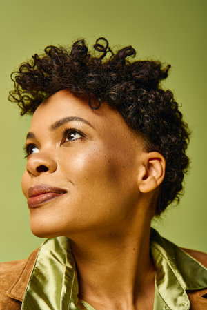 Beautiful woman with curly hair showcases modern fashion in a chic and trendy setting.