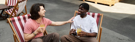A charming couple shares smiles and drinks at a cozy outdoor cafe on their date.の写真素材
