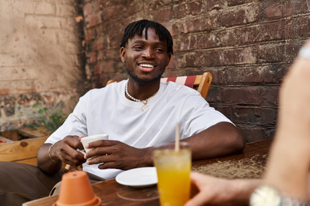 Two lovebirds connect over drinks, laughter, and sweet moments in a charming cafe setting.の写真素材