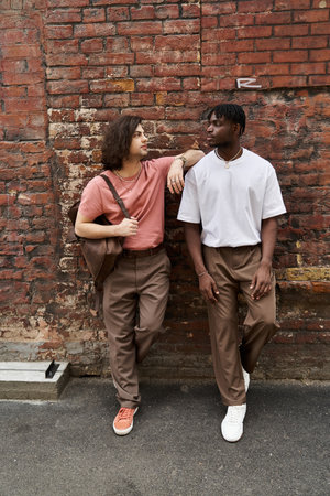 Two affectionate men share a delightful moment on their cafe date, surrounded by warm ambiance.の写真素材