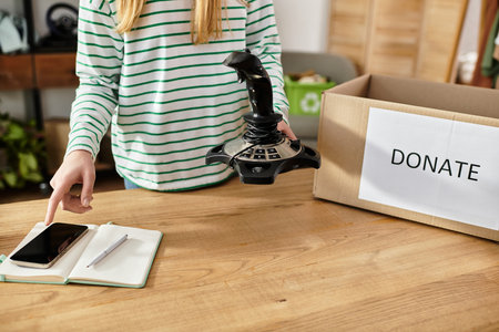 Young woman organizes and donates her clothes, promoting a sustainable lifestyle practice.