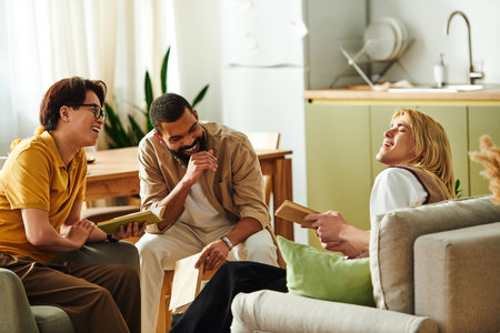 Three diverse young men enjoy a lively discussion in a stylish, inviting book club atmosphere.のeditorial素材
