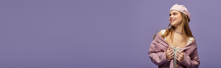 A young woman showcases a fashionable spring outfit against a purple backdrop, exuding youthfulness, bannerのeditorial素材