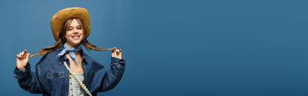 A young woman embraces spring in a stylish denim jacket against a blue backdrop, radiating joy.