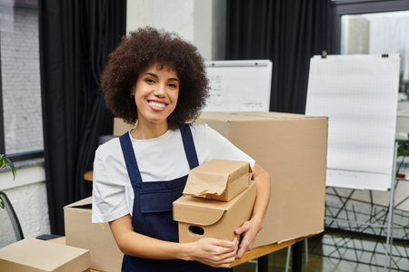Cheerful woman organizes boxes and prepares for moving day in a modern environment.