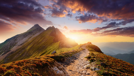 A breathtaking sunrise illuminates rugged mountains, enticing adventurers to explore new heights.の素材