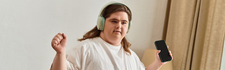 Joyful atmosphere as a young woman embraces music, radiating strength and confidence.のeditorial素材