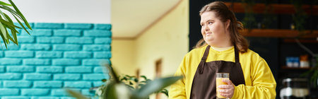 Confident young woman with Down syndrome in a colorful cafe, radiating warmth with her drink.のeditorial素材