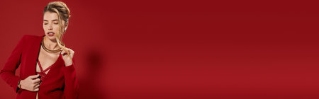 A beautiful young woman poses confidently in a chic red ensemble, radiating style and elegance.のeditorial素材