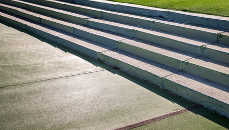 Vibrant paths lead to a sunny sports area where athletes compete energetically.の素材