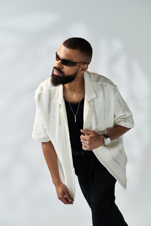 Confident man in a stylish outfit looks relaxed and fashionable.のeditorial素材