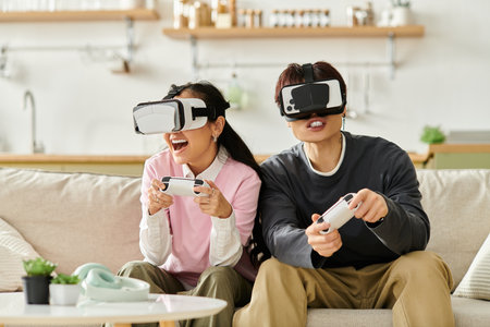 Joyful young couple wears VR headsets while playing games, immersed in their playful world.