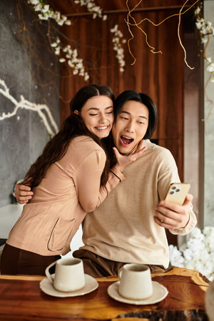 Excited couple indulges in sweet moments together as they plan for their upcoming wedding day.のeditorial素材