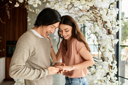 Couple smiles at each other, exchanging meaningful moments as they prepare for an upcoming wedding.のeditorial素材