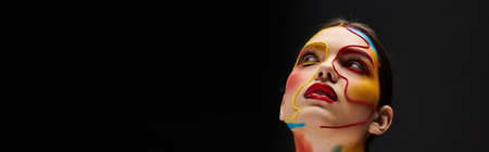 A young woman flaunts vibrant face art, showcasing her creativity with bold colors and designs.