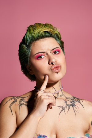 A confident young woman displays her unique fashion and beauty against a pink backdrop.のeditorial素材