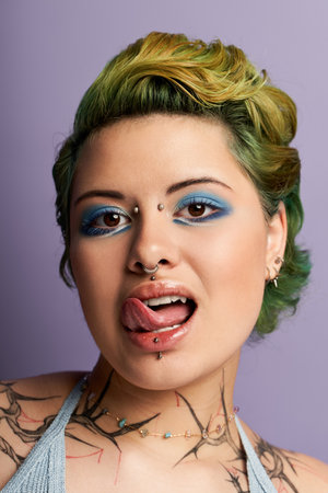 A young woman shows her unique style with vibrant colors and bold makeup.のeditorial素材