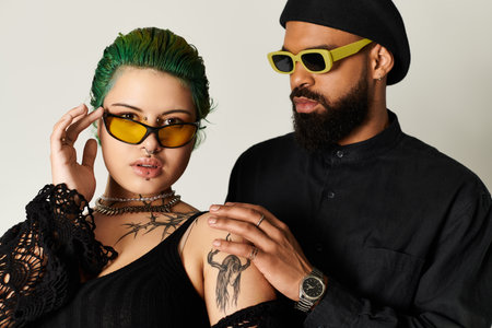 This fashionable young couple showcases their unique style, expressing diversity in a studio.