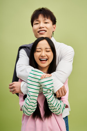 A charming couple with joyful expressions showcases love and style, framed by a colorful setting.