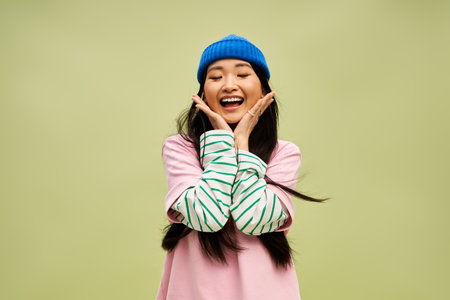 Young appealing woman in casual stylish attire posing cheerfully.のeditorial素材