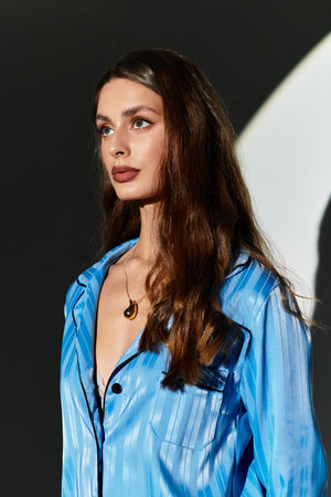 A confident young woman displays her unique style in a creative, modern environment.