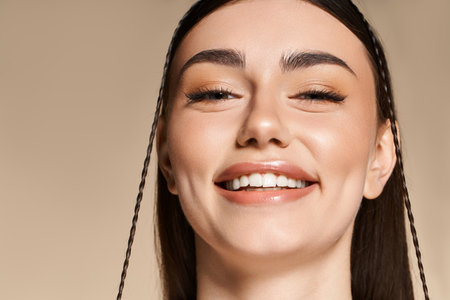 A beautiful young woman with a sun tan beams joyfully, enjoying the warm summer atmosphere.のeditorial素材