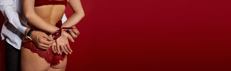 A passionate couple shares a tender moment in an alluring atmosphere, radiating romance and love.の写真素材