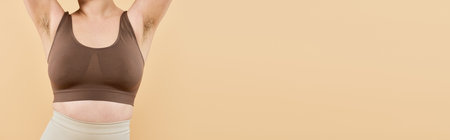 A beautiful young woman radiates confidence while showcasing body positivity in a serene setting.の写真素材