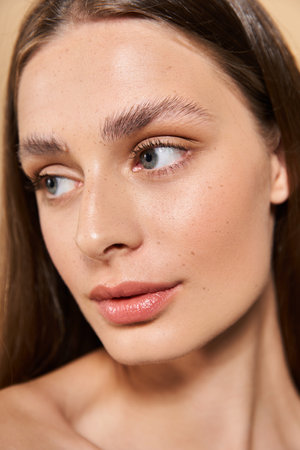 A young woman with flawless skin and elegant features captures the essence of summer fashion.のeditorial素材