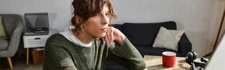 Young student engages in his studies at home, surrounded by a comfortable atmosphere.