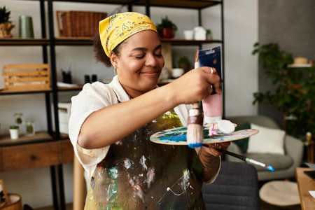 A joyful woman paints at a lively crafting workshop full of creativity.