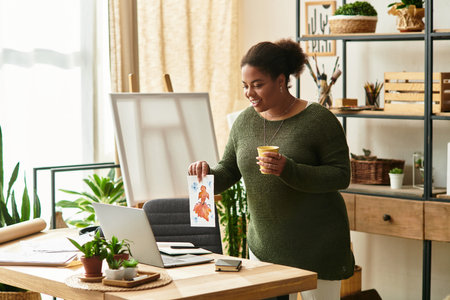 A beautiful woman showcases her latest craft creation while enjoying a refreshing drink.