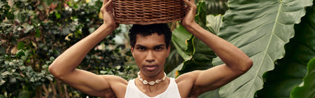 A young stylish man having a tender moment surrounded by lush plants and greenery, embracing his love.の写真素材
