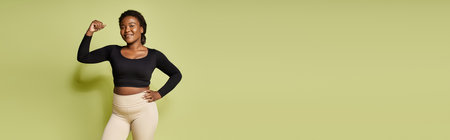 Young fit african american sportswoman confidently poses after an intense workout session, bannerの写真素材