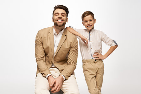 Joyful father and son share laughter and warmth during a memorable Fathers Day celebration.の写真素材