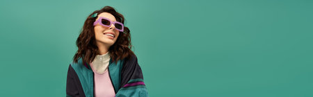 Trendy young woman poses playfully in sporty attire, showcasing her unique fashion sense, banner