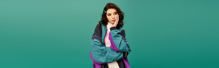 A young woman poses thoughtfully in trendy sportswear, radiating style and confidence, banner